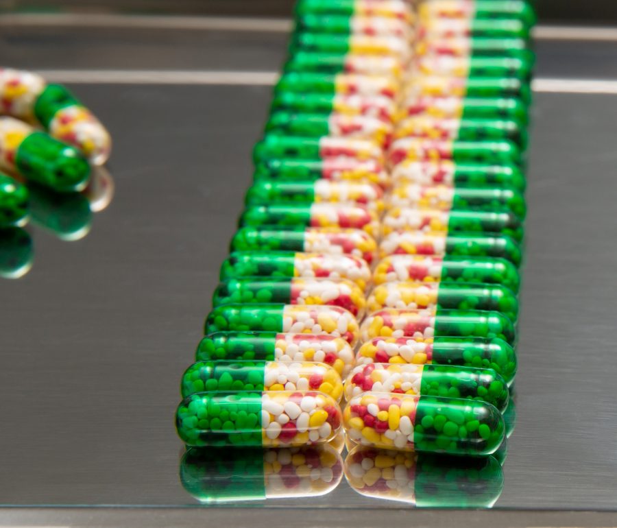 Medicinal capsules on a tray.