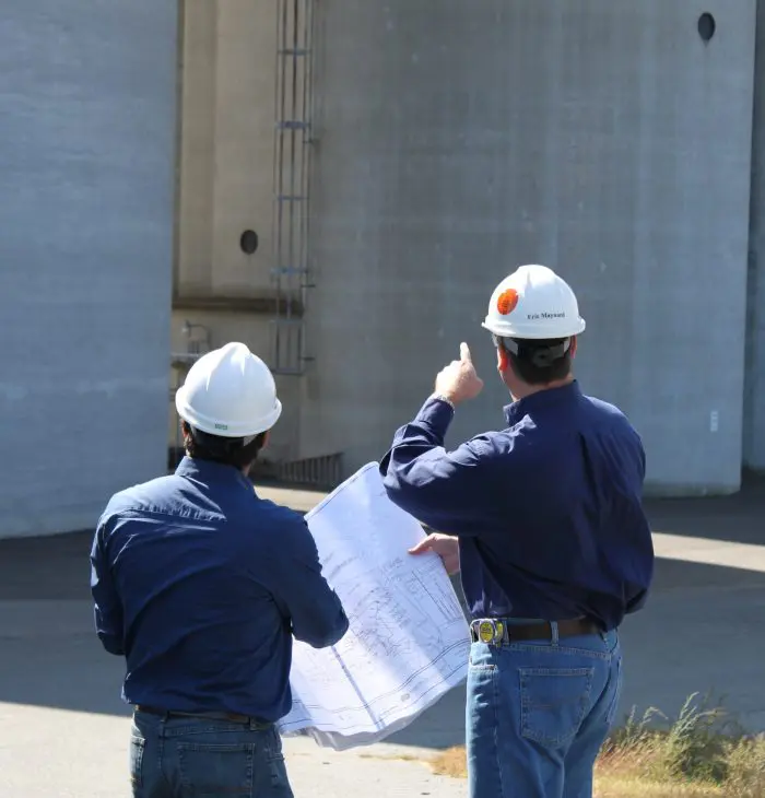 Engineers inspecting a silo
