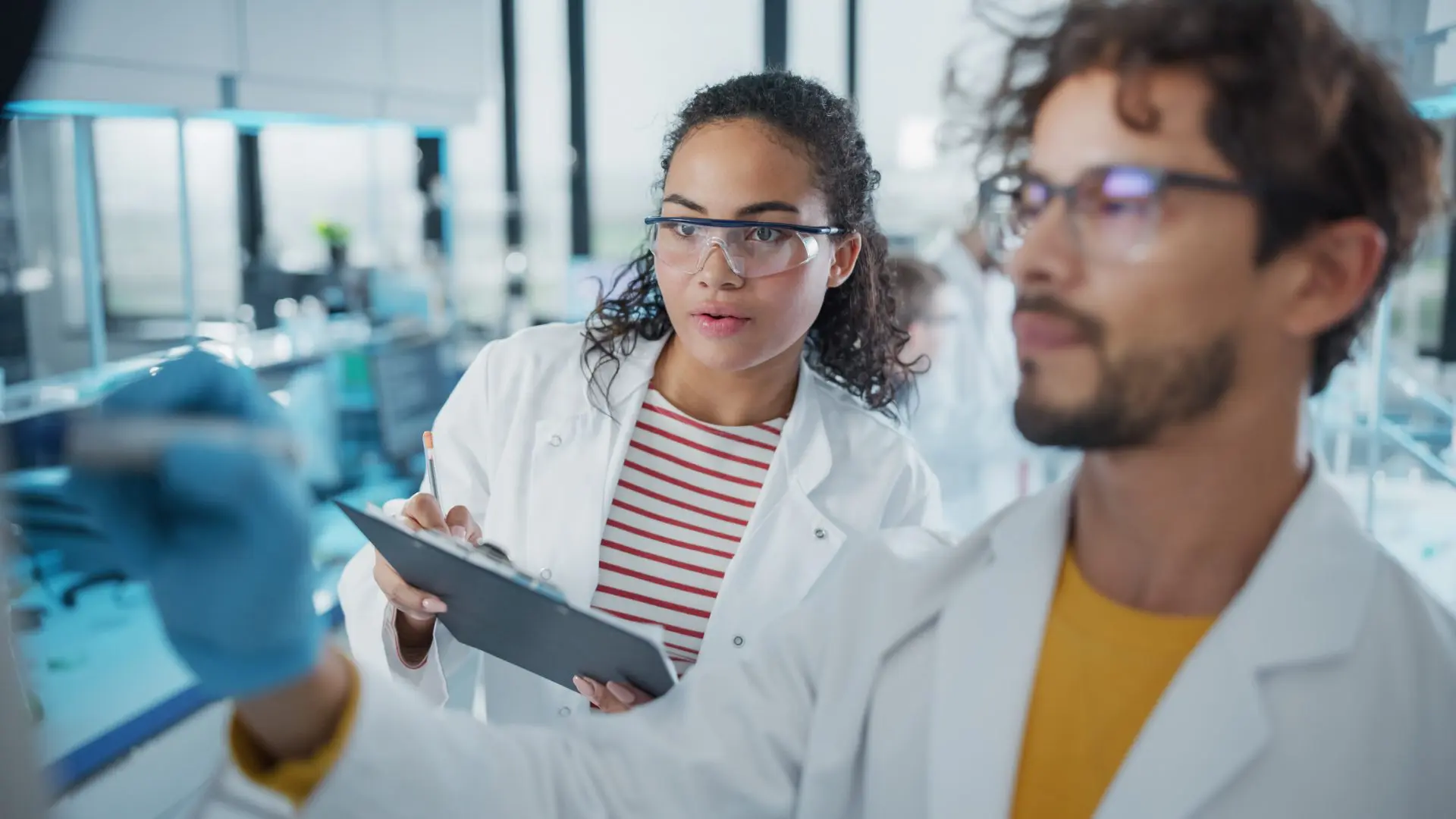 Lab technicians testing materials