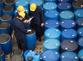 Engineers at a chemical facility classifying barrels