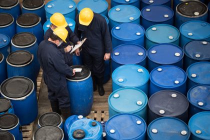 Engineers at a chemical facility classifying barrels
