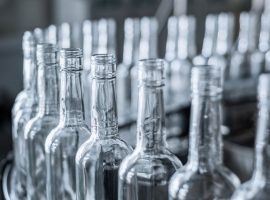 Empty glass bottles on the conveyor