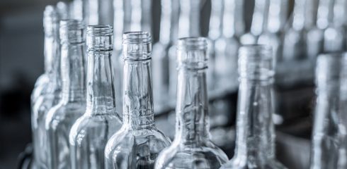 Empty glass bottles on the conveyor